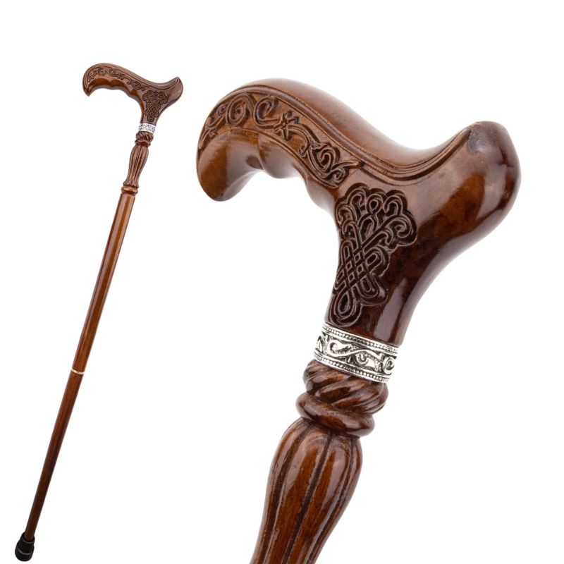 antique style carved wooden walking cane - close-up view