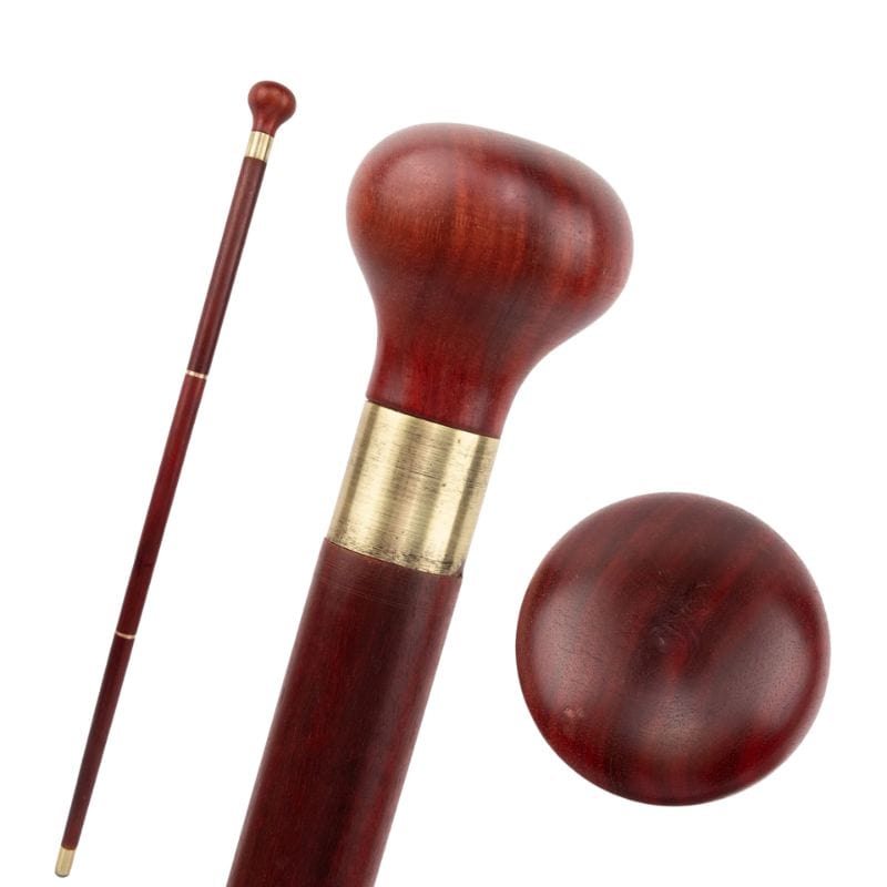 carved wooden walking stick with cork grip