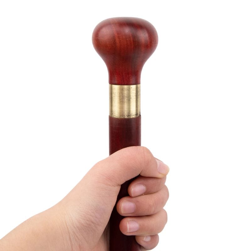 carved wooden walking stick with cork grip - pommel detail